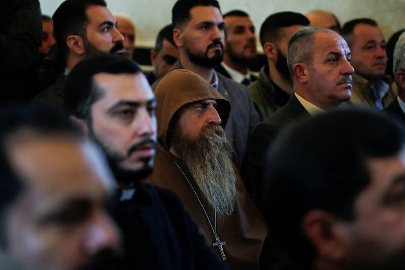 Iraqi Christians attend a service. Reuters