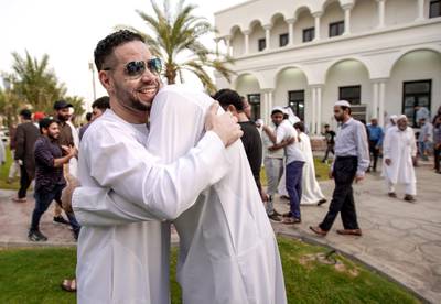 Abu Dhabi, United Arab Emirates, August 11, 2019.  Eid prayers at Zayed The 2nd Mosque.  Friends and relatives great one another after Eid prayers.Victor Besa/The NationalSection:  NAReporter: Haneen Dajani