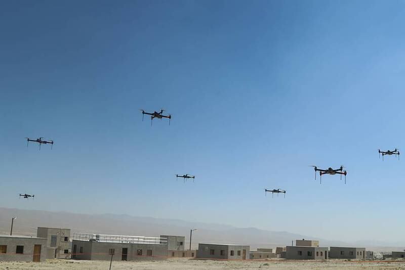 A swarm of drones above the mock city of Razish in the first of many exercises.
