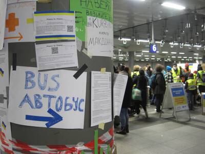 Signs at Berlin's main strain station offer help and accommodation for refugees fleeing Ukraine. Passengers said trains from Ukraine were packed with people trying to leave the country.