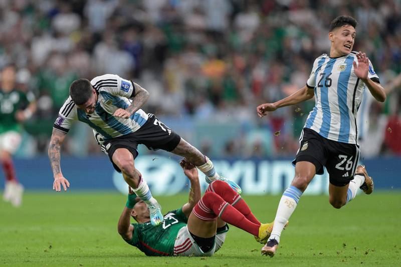 Argentina's Rodrigo de Paul and Mexico's Jesus Gallardo fight for the ball. AFP