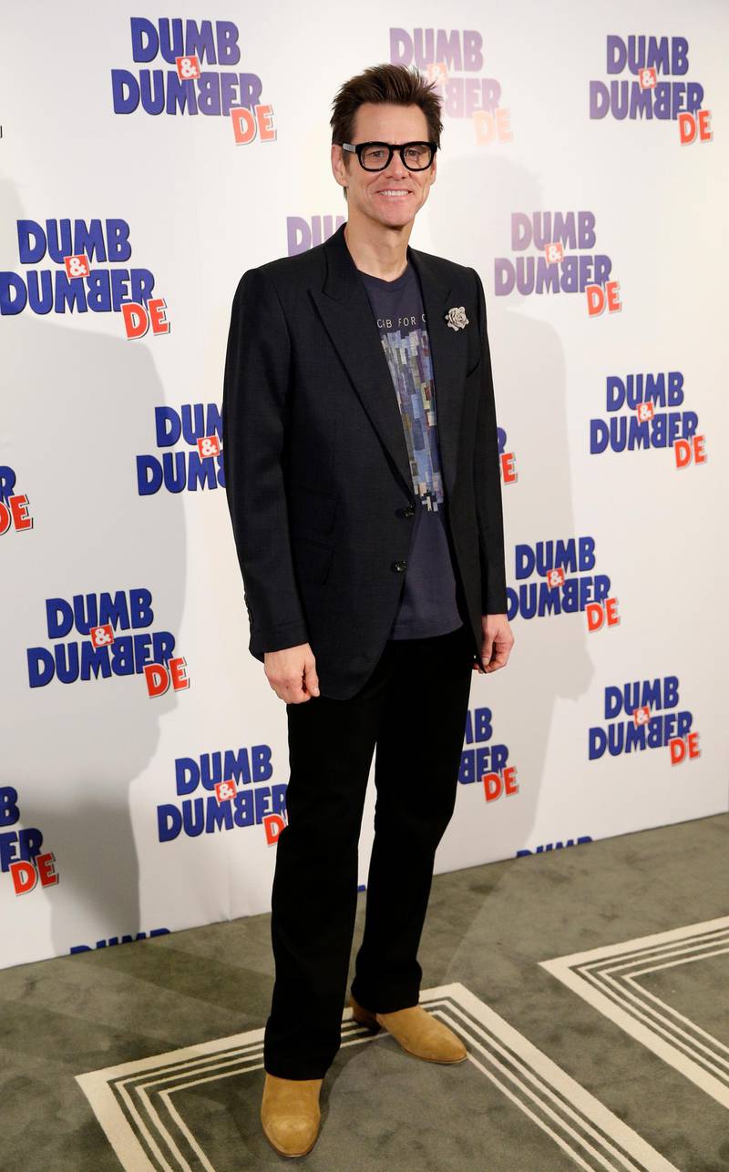 epa04503465 Canadian actor Jim Carrey poses during a photocall for 'Dumb and Dumber To' held at the Peninsula hotel in Paris, France, 25 November 2014. The movie will be released in French theaters on 17 December.  EPA/YOAN VALAT