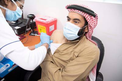 Abdullah Al Falasi, director general of Dubai Government Human Resources Department, receives his first dose of the Pfizer-BioNTech vaccine. Courtesy: Dubai Media Office