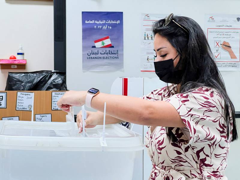 A Lebanese expat casts her vote in Lebanon's parliamentary election at the Lebanese school in Doha, Qatar. Reuters