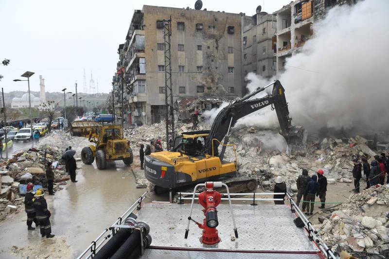 Rescue teams look for survivors under the rubble of a collapsed building in the northern Syrian city of Aleppo. AFP