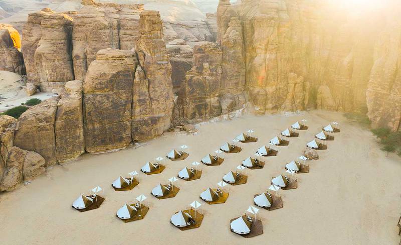 The AlUla Adventure Tour includes travellers glamping at the Masarat Camp site, surrounded by ancient rock formations. Photo: Experience AlUla