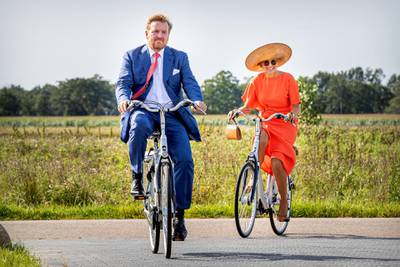 OOSTSTELLINGSWERF, NETHERLANDS - SEPTEMBER 17: King Willem-Alexander of The Netherlands and Queen Maxima of The Netherlands ride on bicycles as they visit ECOstyle, Biosintrum and EcoMinutypark during their visit to the region of South East Friesland on September 17, 2020 in Ooststellingswerf, Netherlands. The theme of the visit is sustainable entrepreneurship and the cooperation with the education sector.  (Photo by Patrick van Katwijk/Getty Images)