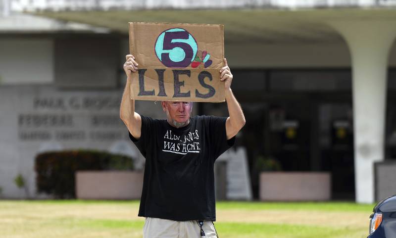 A Trump supporter outside the Paul S  Rogers Federal Building and US Courthouse in West Palm Beach, Florida. AP