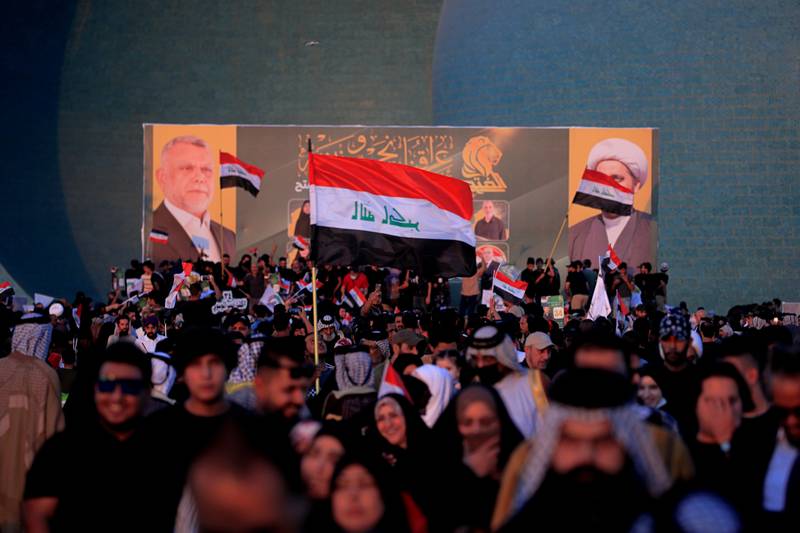 Followers of political movement Al Fatah chant during a rally before the parliamentary elections in Baghdad. AP