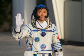 Chinese astronaut Gui Haichao waves during a send-off ceremony for his manned space mission at the Jiuquan Satellite Launch Center in northwestern China, on Tuesday. AP