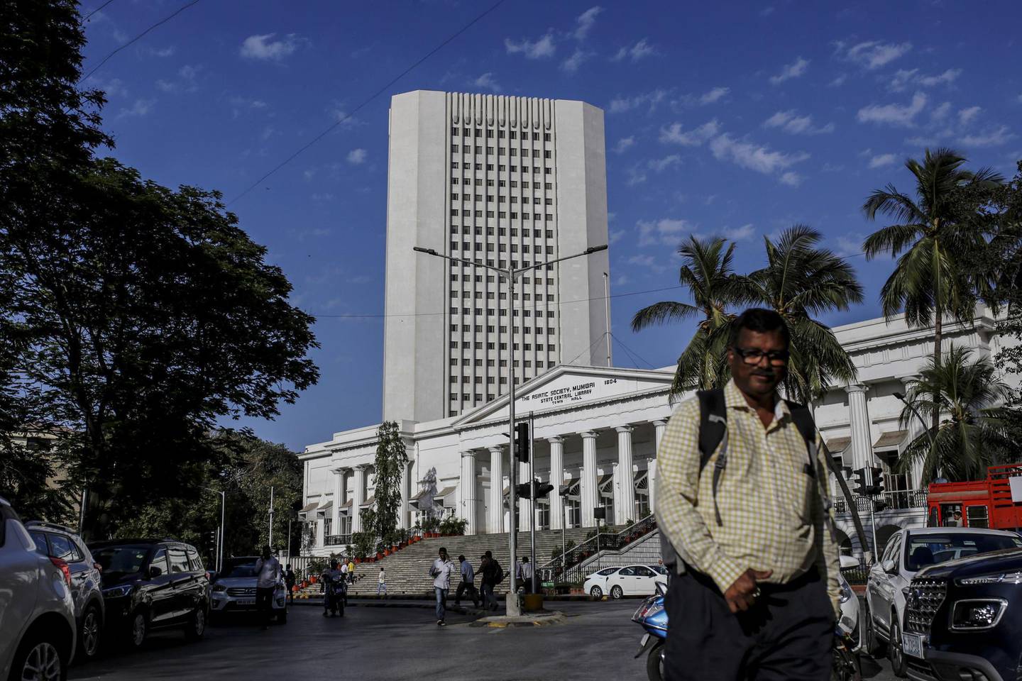 A pedestrian walks past the Reseve Bank of India (RBI) in Mumbai, India, on Monday, March. 9, 2020. A top Indian official said there's no need for the government to take immediate steps to support the economy following a crash in oil prices that has sent financial markets into a tailspin. Photographer: Dhiraj Singh/Bloomberg