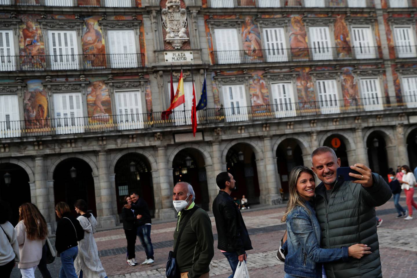 Tourists take selfies at Plaza Mayor square in Madrid, Spain, October 3, 2021. Reuters