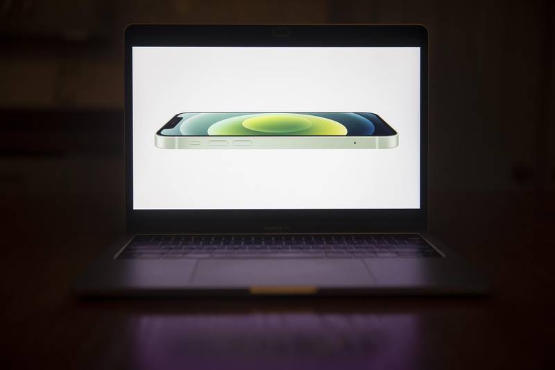 The Apple iPhone 12 is unveiled during a virtual product launch seen on a laptop computer in Tiskilwa, Illinois, US.  Bloomberg