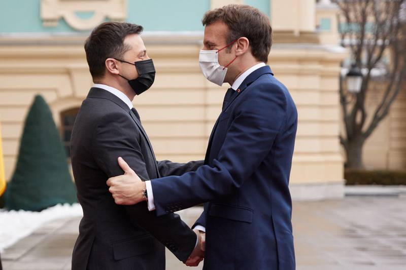 Mr Macron also travelled to Kiev to meet Ukrainian President Volodymyr Zelensky, left. AFP