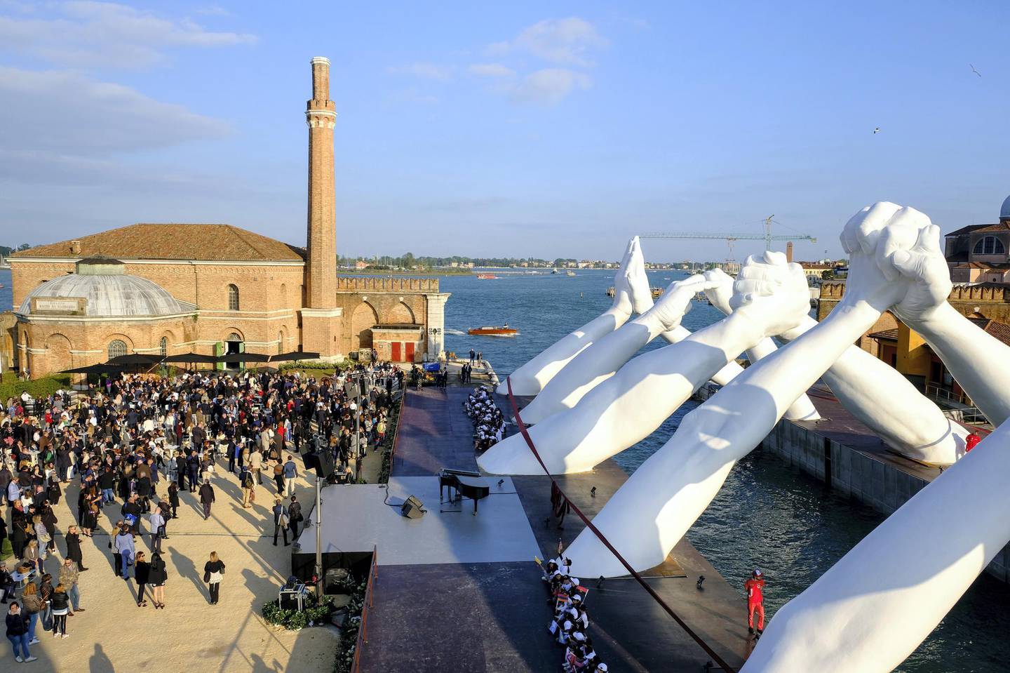 VENICE, ITALY - MAY 09: Lorenzo Quinn‚Äôs Building Bridges by Halcyon Gallery during Venice Biennale 2019 on May 09, 2019 in Venice, Italy. (Photo by David M. Benett/Dave Benett/Getty Images for Halcyon Art International)