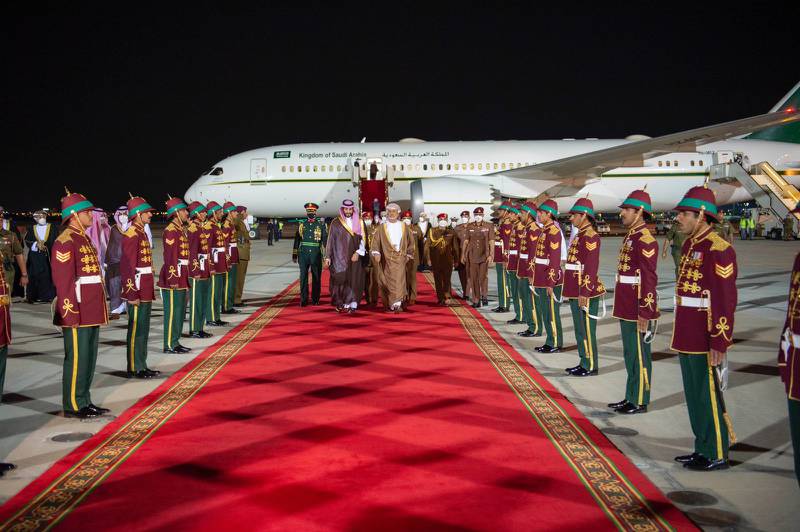 Prince Mohammed and Sultan Haitham walk through an honour guard in Muscat. Photo: SPA