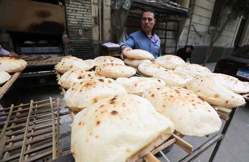 A man buys bread from a bakery in Cairo. Egypt is facing a potentially destabilising rise in food prices. EPA