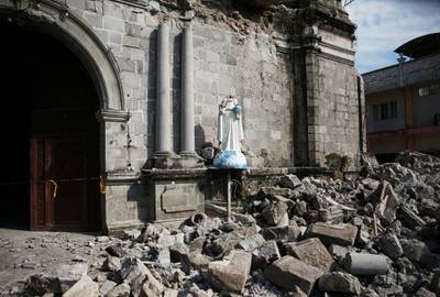 Debris and rubble surround the Santa Catalina de Alejandria Parish. Reuters