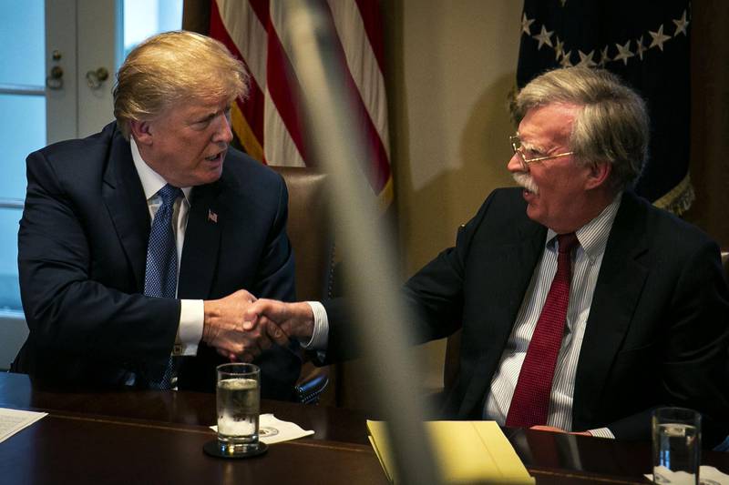 U.S. President Donald Trump, left, shakes hands with John Bolton, national security advisor, during a meeting with senior military leadership in the Cabinet Room of the White House in Washington, D.C., U.S., on Monday, April 9, 2018. Trump said he'll decide within two days on U.S. retaliation against Syria for a suspected chemical weapons attack by President Bashar al-Assad's regime over the weekend, and suggested Russian President Vladimir Putin may share responsibility. Photographer: Al Drago/Bloomberg