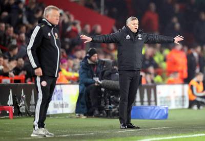 Manchester United manager Ole Gunnar Solskjaer, right, and his Sheffield United counterpart Chris Wilder. PA