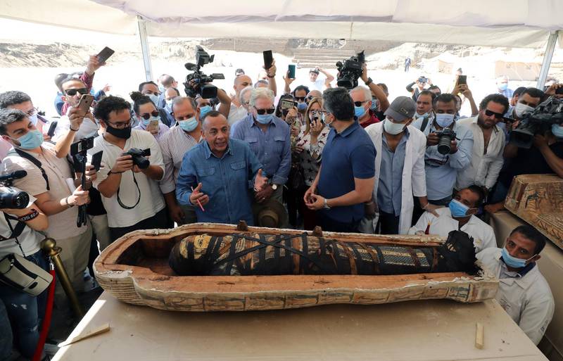 Secretary-general of the Supreme Council of Antiquities of Egypt Mostafa Waziri (C-L) speaks next to a sarcophagus discovered at Saqqara Necropolis, Giza, Egypt. An Egyptian archaeological mission uncovered a total of 59 intact and sealed coffins in three burial shafts dozen of meters deep in the Saqqara necropolis. EPA