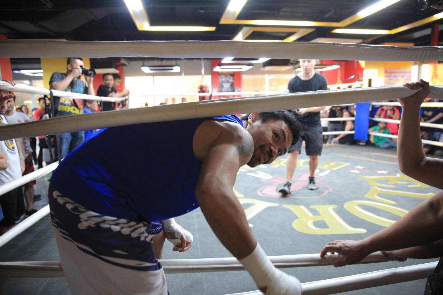 Manny Pacquiao climbs through the ropes after ring work at the Elorde Boxing Gym in Manila. Jake Versoza for The National