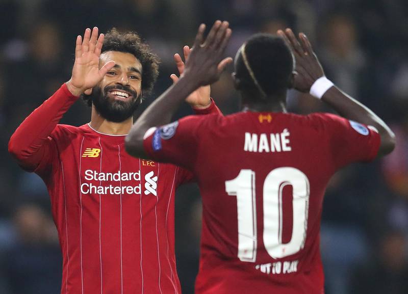 GENK, BELGIUM - OCTOBER 23: Mohamed Salah of Liverpool celebrates with teammate Sadio Mane after scoring his team's fourth goal during the UEFA Champions League group E match between KRC Genk and Liverpool FC at Luminus Arena on October 23, 2019 in Genk, Belgium. (Photo by Catherine Ivill/Getty Images)