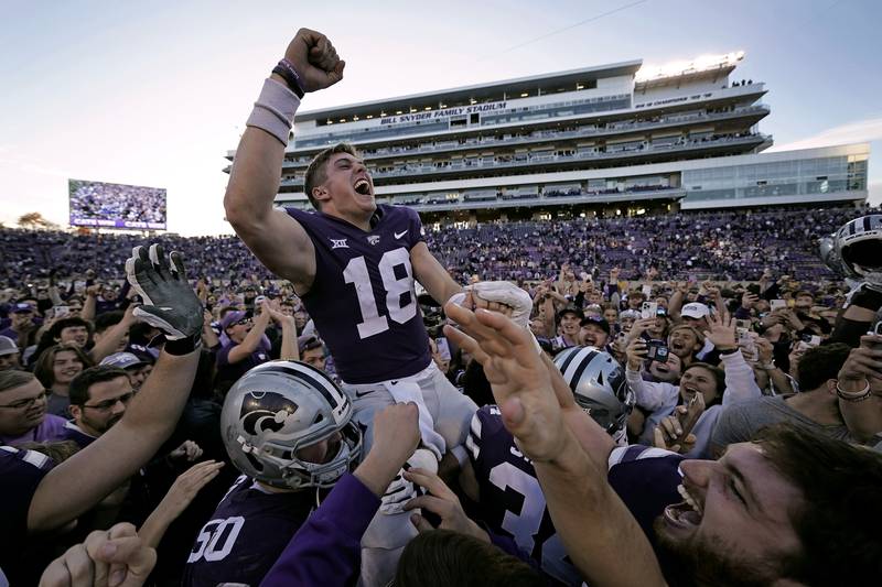 Kansas State quarterback Will Howard is carried off the field by teammates after an NCAA college football game against Oklahoma State, in Manhattan, Kansas. Kansas State won 48-0.  AP