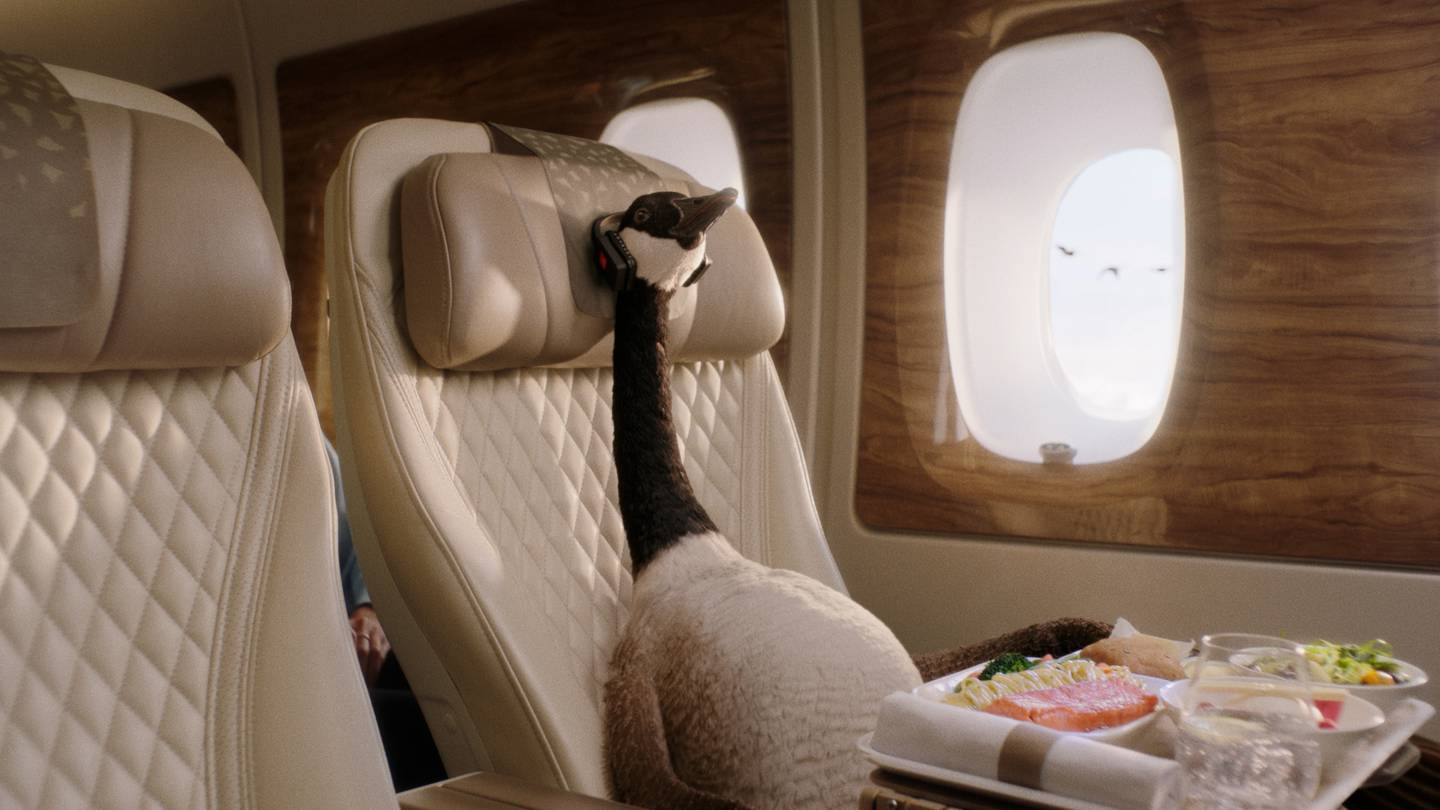 Gerry settles down in his premium economy cabin as he flies by his friends. Photo: Emirates