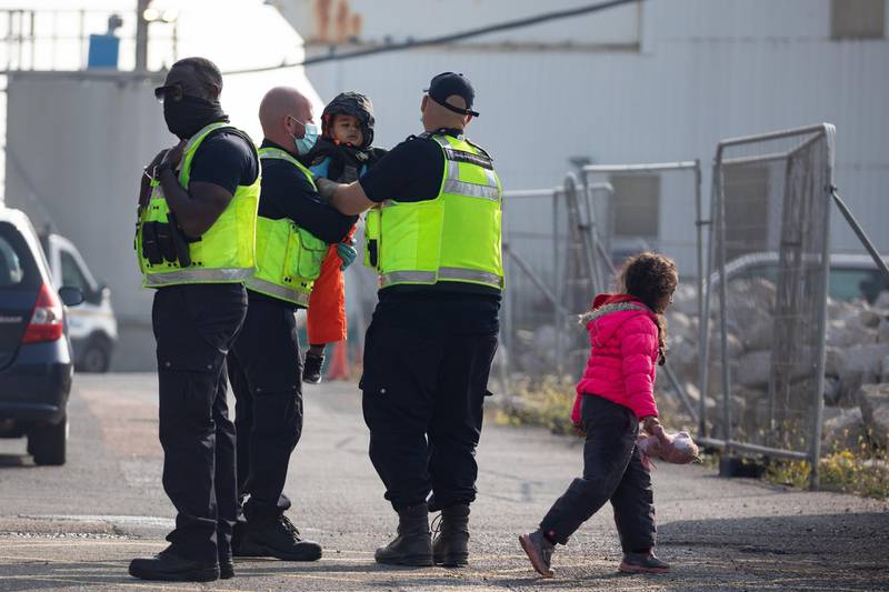Priti Patel asked officials in her department to look into the possibility of a processing facility on Ascension Island and St Helena. A migrant family is taken into port in Dover. Getty Images