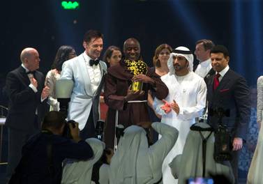 DUBAI, UNITED ARAB EMIRATES - HH Sheikh Hamdam bin Mohammed Al Maktoum, Crown Prince of Dubai with the winner of the Global Teacher Prize 2019 Peter Tabichi from Kenya with actor Hugh Jackman and the teacher finalist at the Global Education and Skills Forum 2019 at Atlantis, The Palm. Leslie Pableo for The National for Anam Rizvi's shorty