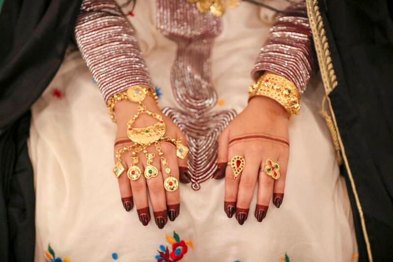 Huda Ahmad, an actor, portrays an Emirati bride for photos with the public at the Al Hosn Festival, Abu Dhabi.