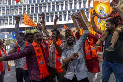 Supporters of India's ruling Bharatiya Janata Party celebrate in Mumbai during the inauguration of the Ram temple in Ayodhya. AP Photo
