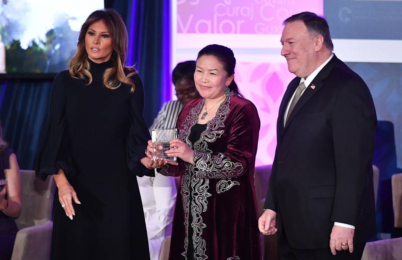 International Women of Courage  Award recipient Sayragul Sauytbay of Kazakhstan poses with US Secretary of State Mike Pompeo and First Lady Melania Trump.  AFP