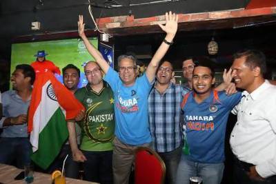 Indian and Pakistani cricket fans at the Time Cafe in Ramee Royal hotel in Dubai.