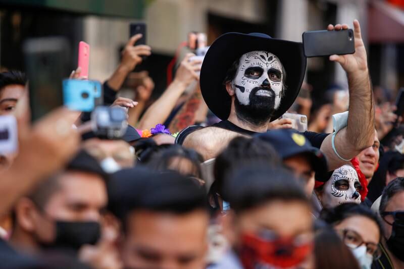A man with a skull face painting attends the annual Day of the Dead parade in Mexico City. Reuters