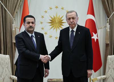 Sudani and Erdogan shake hands at the conclusion of their meeting at the Presidential Palace in Ankara. AFP