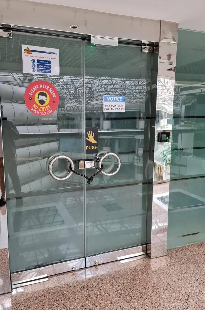 The office of the Royal Regis Tours and Travels in Al Mamzar Centre in Dubai remains closed, and the mobile phones of the sales staff also remain switched off. Photo: Wei Choon Yean