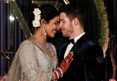 Newlyweds Priyanka Chopra, 36, and Nick Jonas, 26, pose for a photograph during a reception at a hotel in New Delhi on December 4, 2018. Photo: Reuters