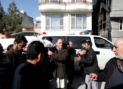 Relatives carry the body of one of the female judges shot dead by unknown gunmen in Kabul, Afghanistan. Reuters
