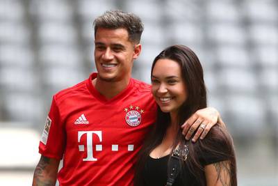 Bayern Munich's Philippe Coutinho poses with his wife, Aine Coutinho, during the presentation. Reuters