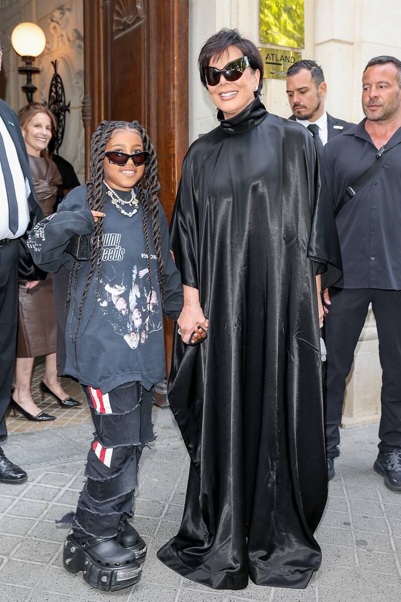 North West and Kris Jenner arrive at the Balenciaga show. Getty For Balenciaga