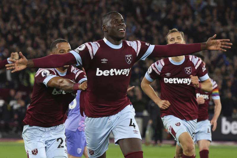 West Ham's Kurt Zouma, center, celebrates with teammates after scoring his sides first goal during the English Premier League soccer match between West Ham United and Bournemouth at the London Stadium in London, England, Monday, Oct.  24, 2022.  (AP Photo / Ian Walton)