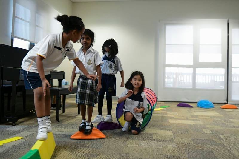 Grade 1 pupils tackle an obstacle course.
