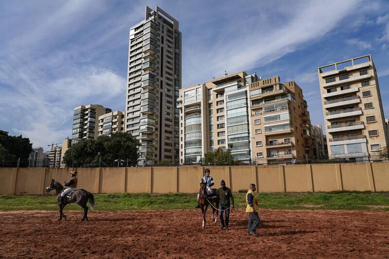 Ya Gharami waits for the start of his race in the shadow of Beirut's high-rise apartment blocks.