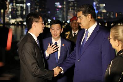 Venezuela's President Nicolas Maduro shaking hands with Secretary of the Nanshan District Committee of Shenzhen City Huang Xiangyue during a welcoming ceremony in Shenzhen, China on September 9. Miraflores Palace Press Office/AFP