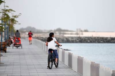 A bike ride on Al Bateen boardwalk.  Khushnum Bhandari / The National 
