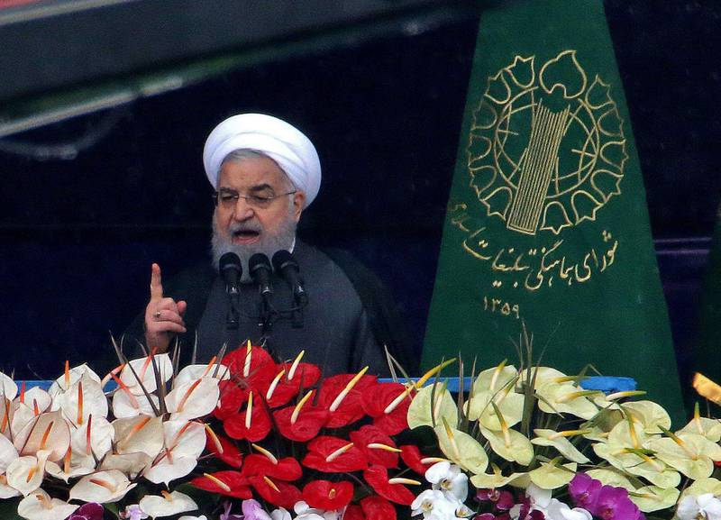 Iranian President Hassan Rouhani (C) speaks during a ceremony celebrating the 40th anniversary of Islamic Revolution in the capital Tehran's Azadi (Freedom) square on February 11, 2019. Rouhani blasted a US "conspiracy" against the country as vast crowds in Tehran marked 40 years since the Islamic revolution on February 11. / AFP / ATTA KENARE
