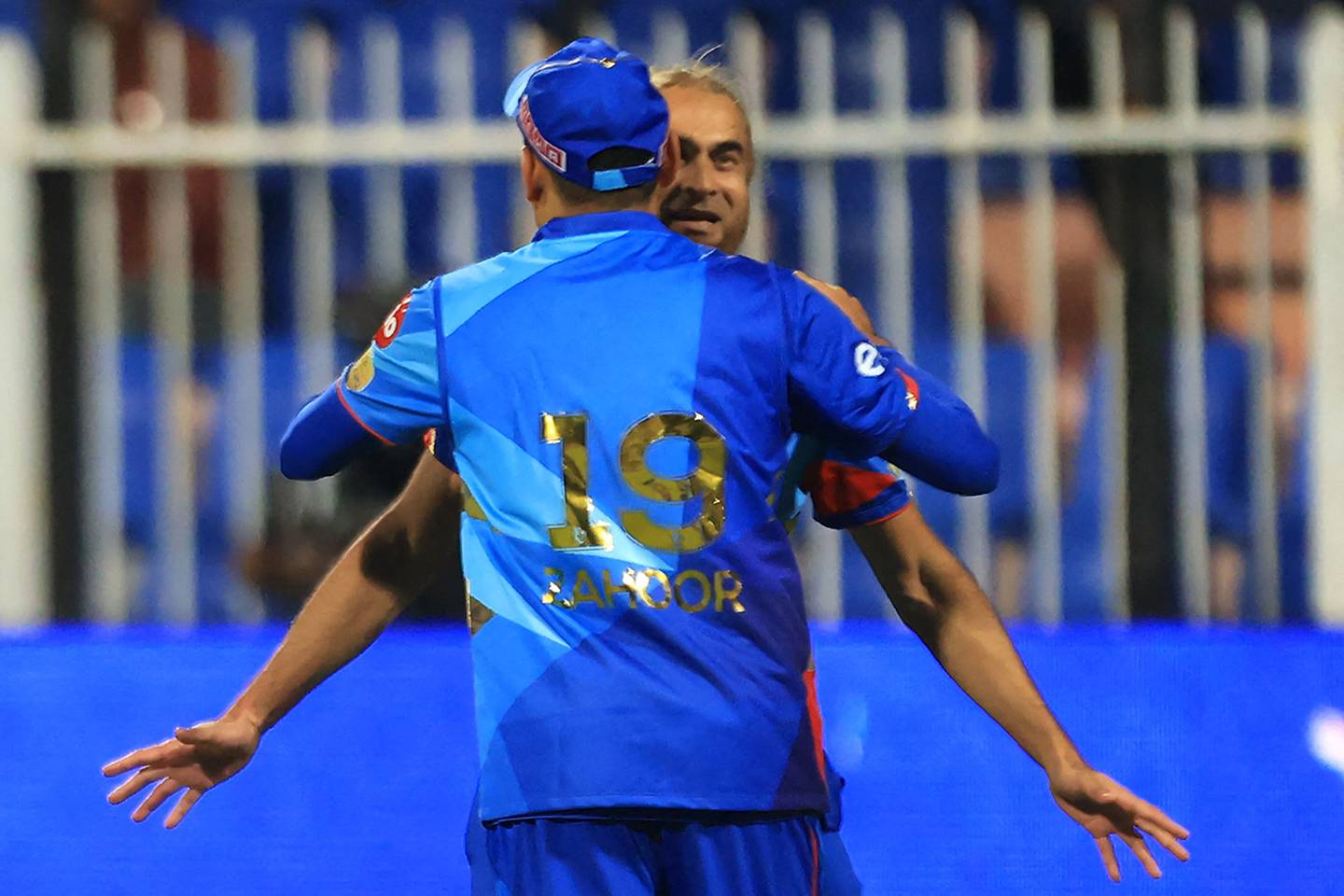 Imran Tahir celebrates with teammate Zahoor Khan after taking the wicket of Sharjah Warriors' Tom Kohler-Cadmore. AFP