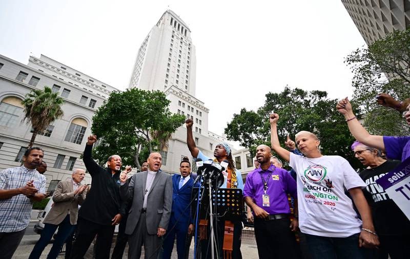Faith, labour, immigrant and community leaders rally outside Los Angeles City Hall to denounce racism and demand change. AFP